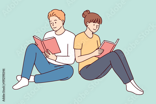 A man and woman sit back to back, immersed in their books during a shared leisure moment. They celebrate literacy and the joy of reading as a couple for a national education event.