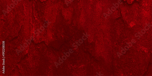 A vintage red paint background on an aged wood surface creates a dark grungy texture with a rustic pattern of antique rust and weathered paper for a bold art backdrop