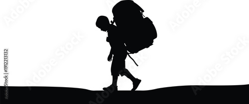 A silhouette of a person hiking with a large backpack