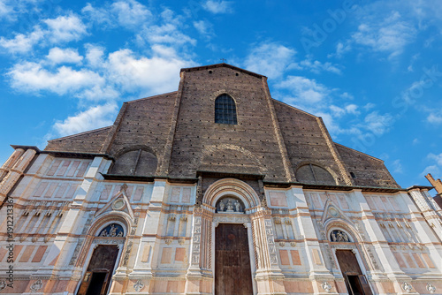 Wallpaper Mural Basilica of San Petronio stands tall on Piazza Maggiore in Bologna, Emilia-Romagna, showing its rich history and architecture under a bright sky Torontodigital.ca