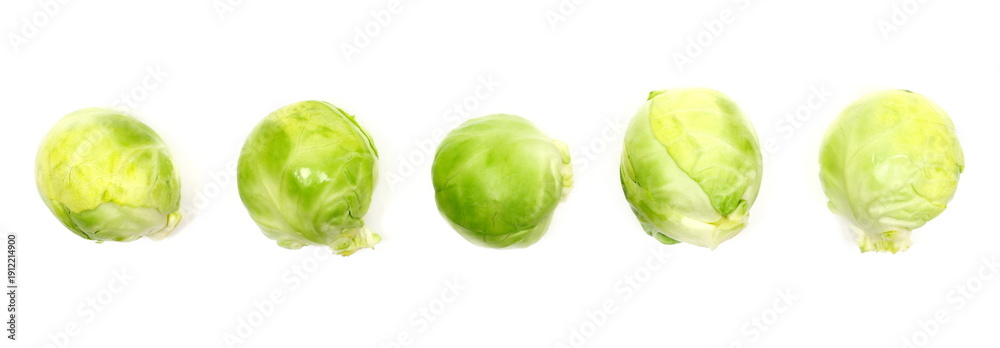Obraz premium Set fresh raw brussels sprouts isolated on white background, top view