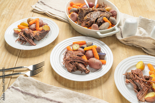 Fotografie Classic beef pot roast dinner with roasted vegetables