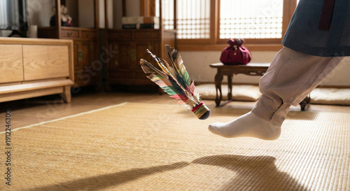 Korean jegichagi shuttlecock mid-kick on floor mat in bright room