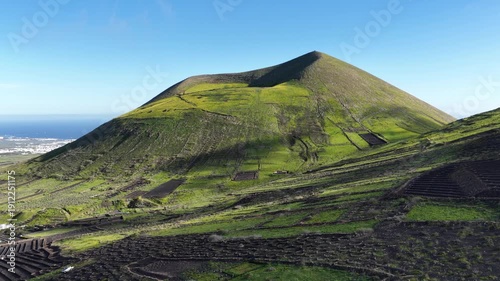 Lanzarote volcano and vineyards aerial view on a clear day