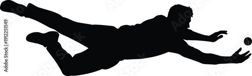 Soccer goalkeeper diving to save a ball in mid air