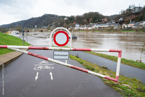 Flood at Moselle river, flooded  sidewalk at city of Trier, Germany, climate change, environmet, heavy rainfalls, rising water levels