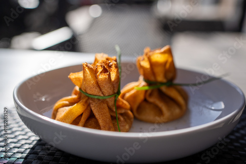 Vászonkép Detailed view of traditional blini pouches tied with chives for spring festival