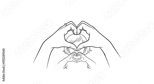 Hands forming a heart shape around a baby bump during pregnancy.