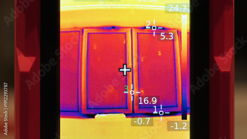 Man Technician Holding Thermal Camera Scope, Monitoring Window Surface Temperature, Heat Loss Control And Building Energy Audit Concept