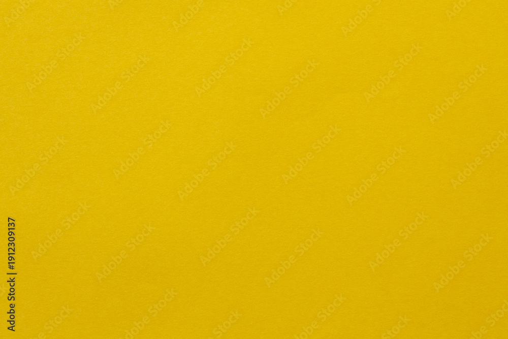 Obraz premium Bright Yellow Solid Color Background with Smooth Surface for Design Projects Template