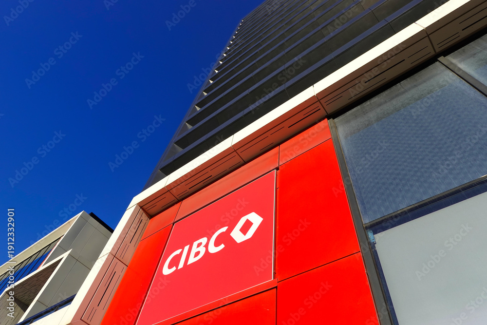 Fototapeta premium TORONTO - OCT 12: Sign of CIBC (Canadian Imperial Bank of Commerce) at branch office in Toronto on Oct 12 2025. CIBC is a Canadian multinational financial services company.