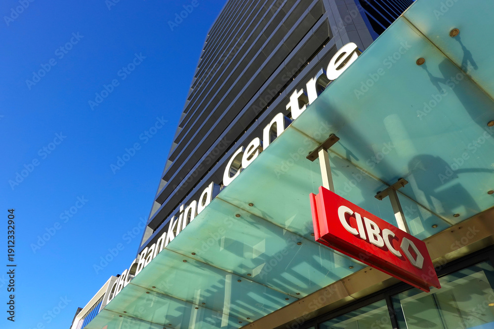 Fototapeta premium TORONTO - OCT 12: Sign of CIBC (Canadian Imperial Bank of Commerce) at branch office in Toronto on Oct 12 2025. CIBC is a Canadian multinational financial services company. 