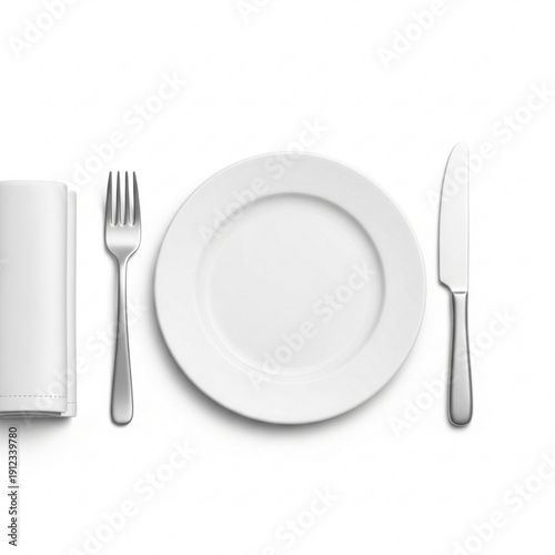 A table setting with a white plate, silver fork, knife, and napkin