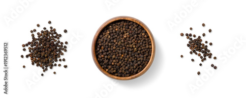 Top view of three piles of black peppercorns, scattered and arranged in a wooden bowl, isolated on a transparent background. Ideal for food design, packaging and culinary use.