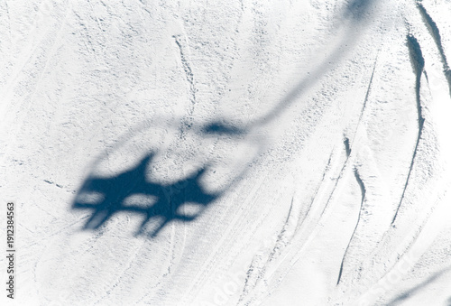 Canada, BC Sun Peaks.  Shadow of chairlift on ski run.  Sun Peaks Ski Resort.