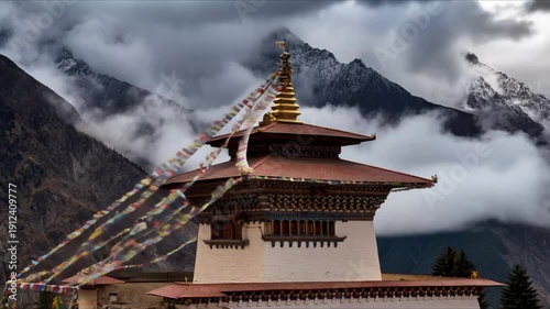 Ancient buddhist temple in himalayan mountains with prayer flags fluttering in wind against dramatic cloudy sky time lapse