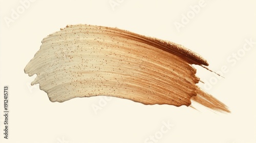 A swatch of creamy makeup transitions from light beige to warm brown with fine flecks,