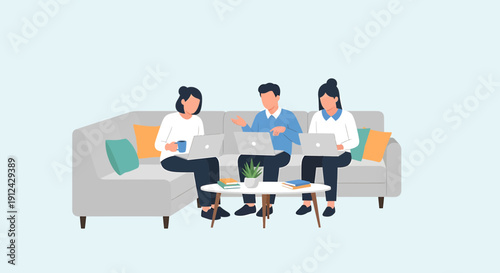 Diverse team collaborating on laptops during a casual meeting on a sofa