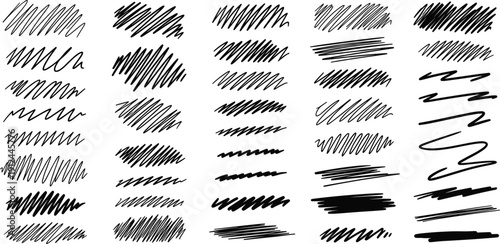 Collection of various black brush strokes and scribbles in different textures and patterns on a clean background, viewed from directly above