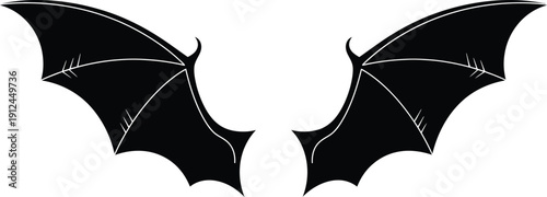 Pair of black stylized demonic bat wings are isolated against a clean white background for graphic design use.