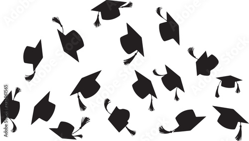 Graduation caps and tassels flying in the air celebration