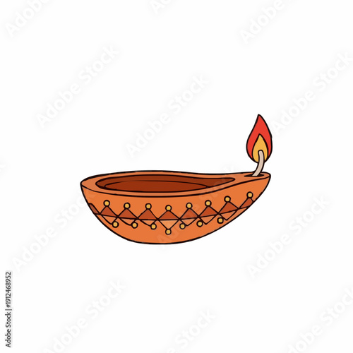 A traditional clay oil lamp with a decorative pattern glows warmly with a bright orange and yellow flame against a white background a symbol of light and celebration