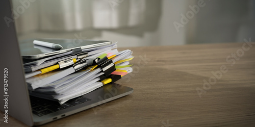 Billede på lærred stacked documents compliance with stack of files and tabs on laptop , representi