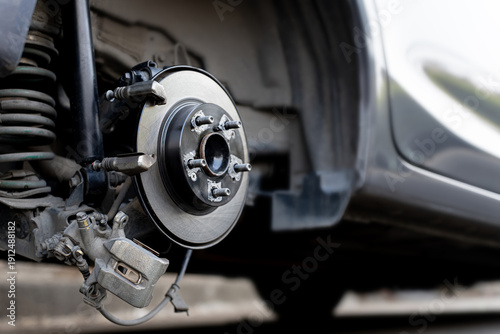 Quadro su tela Car brake system maintenance concept, Close up the rear brake disc and calliper,