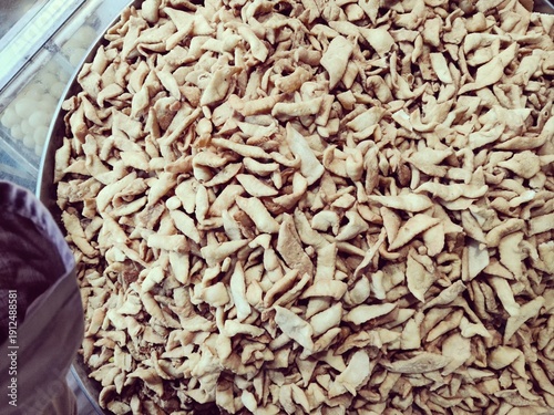 close up of a pile of dried fruit in the market, half-baked snacks local tradational pakistani