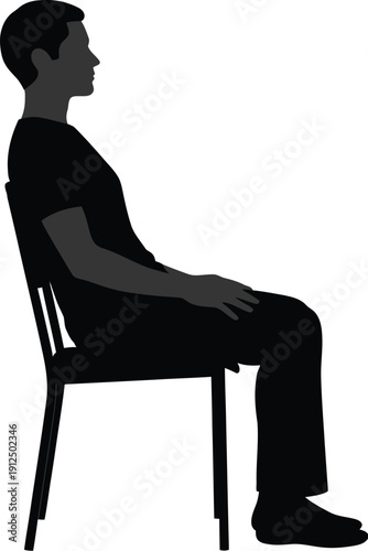 Silhouette profile of a young man sitting upright on a simple chair demonstrating proper posture awareness in a studio.