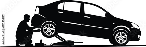 Man Changing Car Tire with Hydraulic Jack Silhouette Illustration