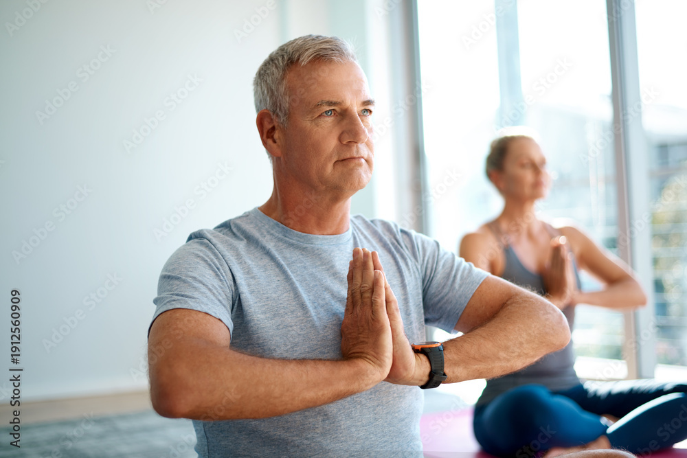 Fototapeta premium Yoga, man and meditation with prayer hands in class for holistic wellness, stress relief and zen. People, mature person and namaste pose in studio for spiritual healing, chakra balance or mindfulness