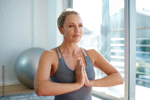 Fotografía Yoga, mature woman and meditation with prayer hands for holistic healing, align chakra and zen