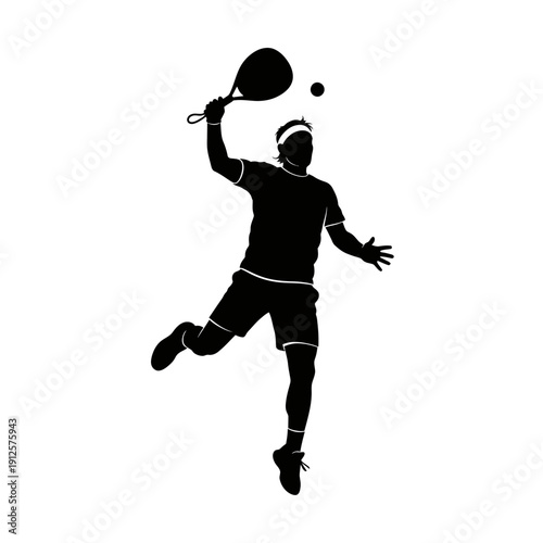 Silhouette of a male tennis player hitting a powerful overhead smash during a match
