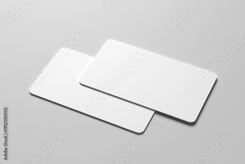 Mockup of two blank white business cards with rounded corners on a minimalist gray background