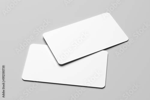 Mockup of two blank white business cards with rounded corners on a minimalist gray background