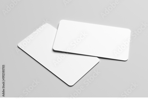 Mockup of two blank white business cards with rounded corners on a minimalist gray background