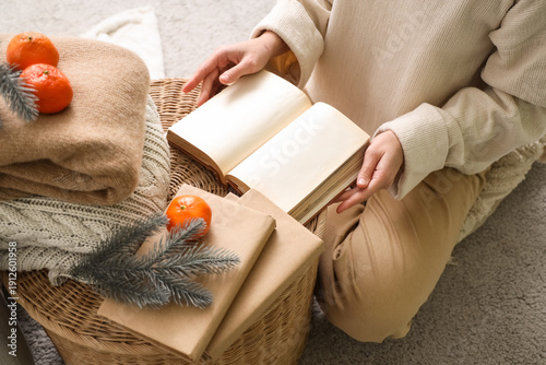 Young woman reading book at...