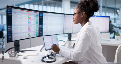 Photography Black Businesswoman Managing Hospital Billing Using Computer Technology