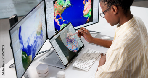 Canvas Print Young Meteorologist Uses Computer