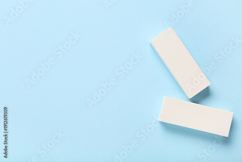 White rubber erasers on blu...