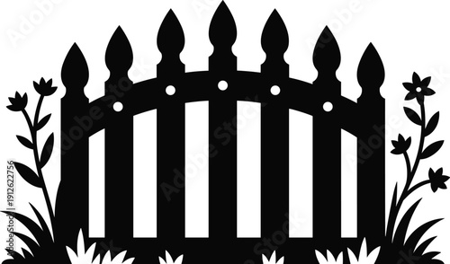 Black silhouette of a picket fence with flowers and grass