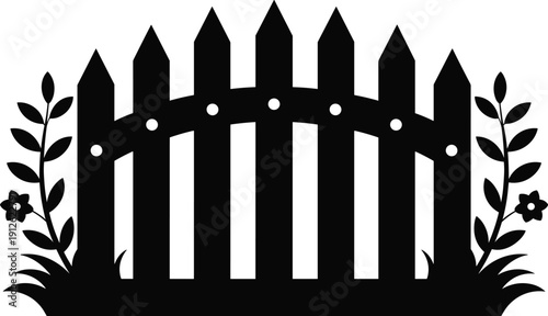 Black silhouette of picket fence with flowers and grass