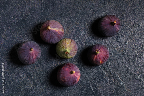 Fresh ripe figs on dark background