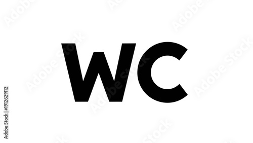 A high-angle shot of a minimalist wooden workspace featuring a sleek laptop and a ceramic coffee mug on a clean white desk