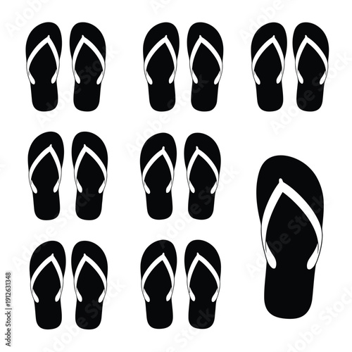 Collection of flip flops with white straps on black soles viewed from top perspective