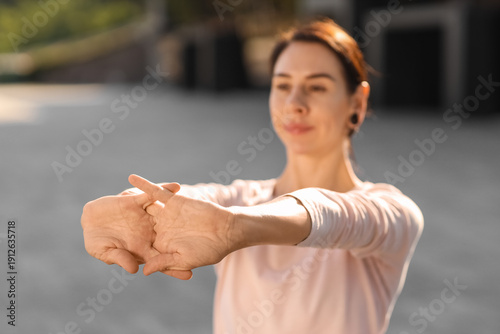 Young woman practicing yoga...