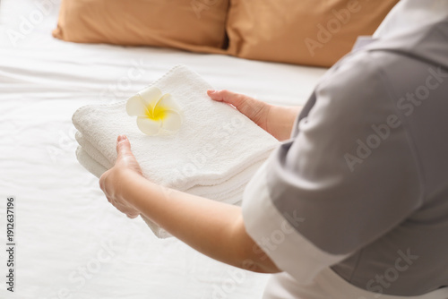 Young female chambermaid wi...