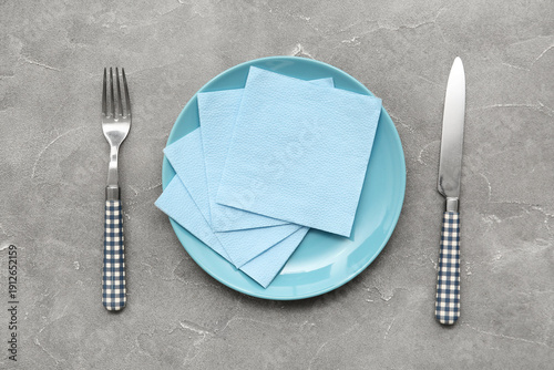 Plate with cutlery and blue...