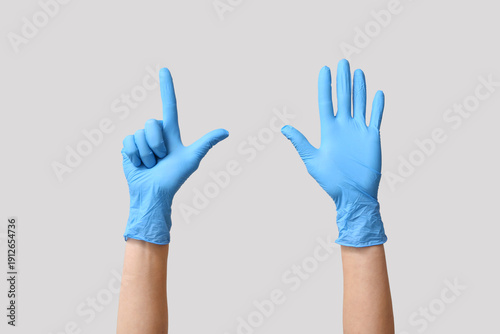 Female hands in medical glo...